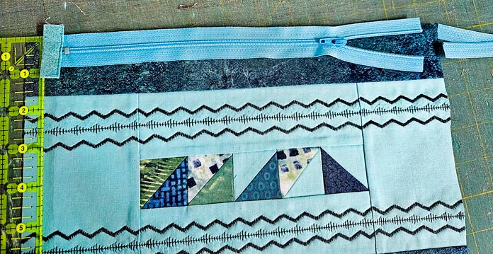 A blue zipper on blue fabric