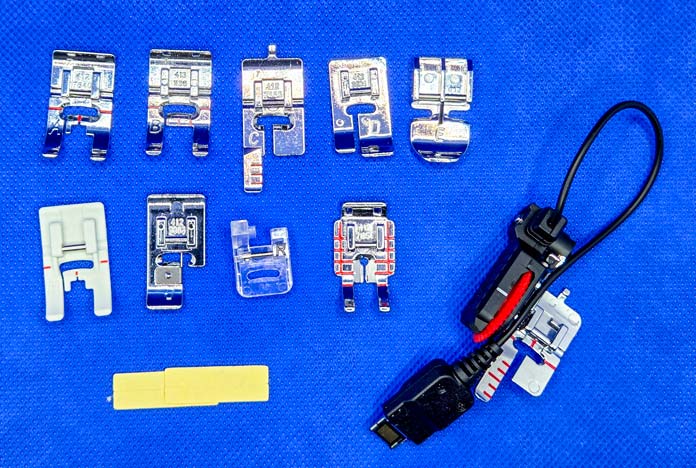 Metal presser feet and a buttonhole foot for a sewing machine