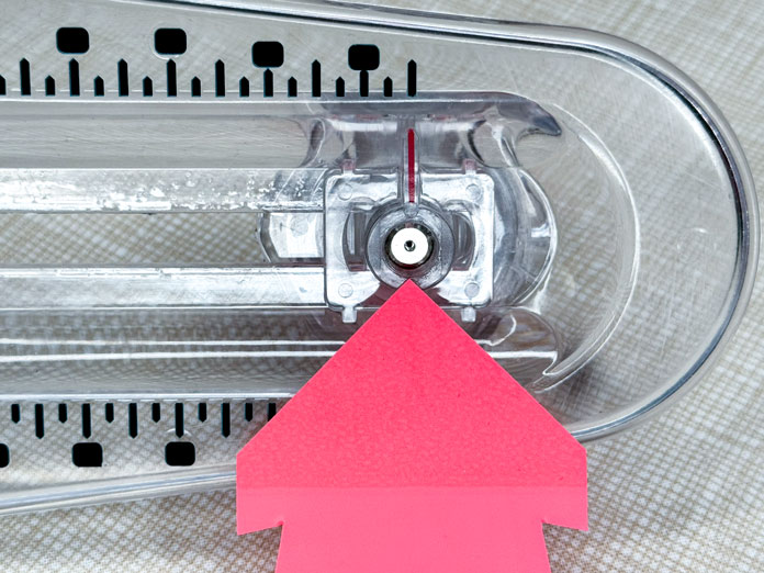 Locating the pin under the TrueCut 360 Circle Cutter knob.