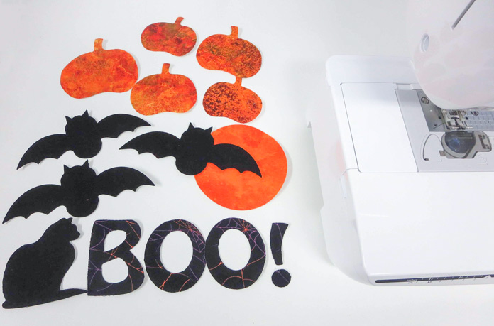 Pumpkin, bat, cat and letters are cut from fusible web; Brother NQ700, HeatnBond Feather Lite