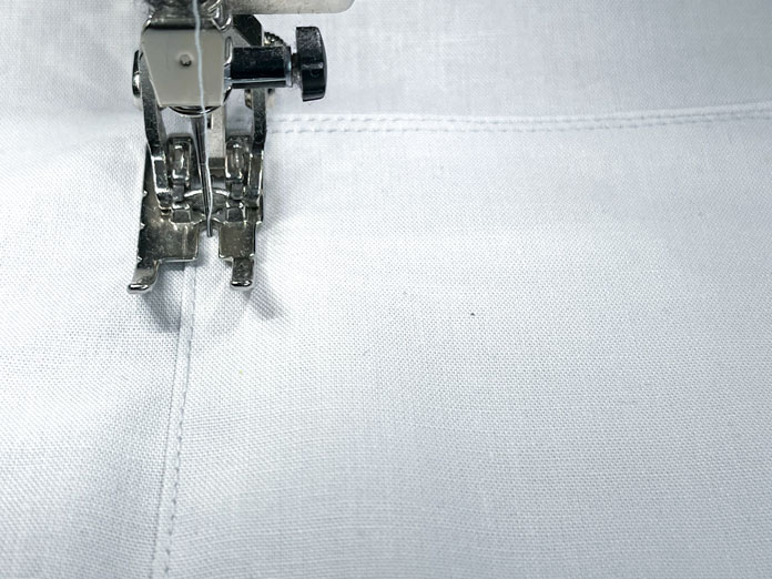 Two stitch lines are sewn next to each other on the pocket sides and bottom.