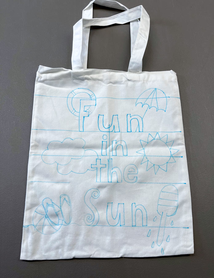 Fun in the sun written on the canvas tote with a blue wash out marker; Mont Marte Signature Fabric Art Set