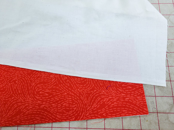 A muslin press cloth on orange fabric; Husqvarna VIKING ONYX 25
