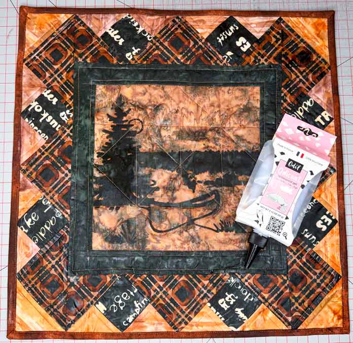 An Odif Odicoat Waterproof Gel pouch was placed on a quilt treated with Odif Odicoat Waterproof Gel.