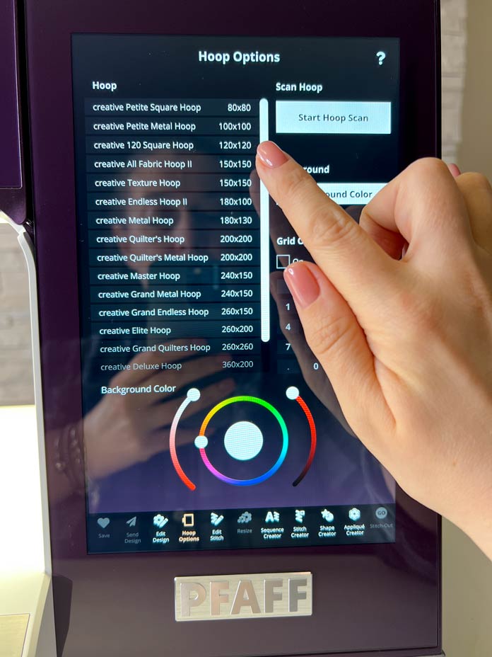 A purple model of the PFAFF creative icon 2 with Embroidery Edit mode and Hoop Option selecting screen 