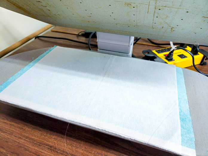 White fabric on a steam press