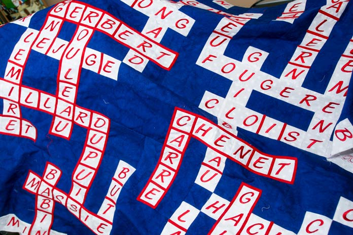 A close-up of the Nos Aïeuls (our Ancestors) quilt with some bias still needing to be attached.
