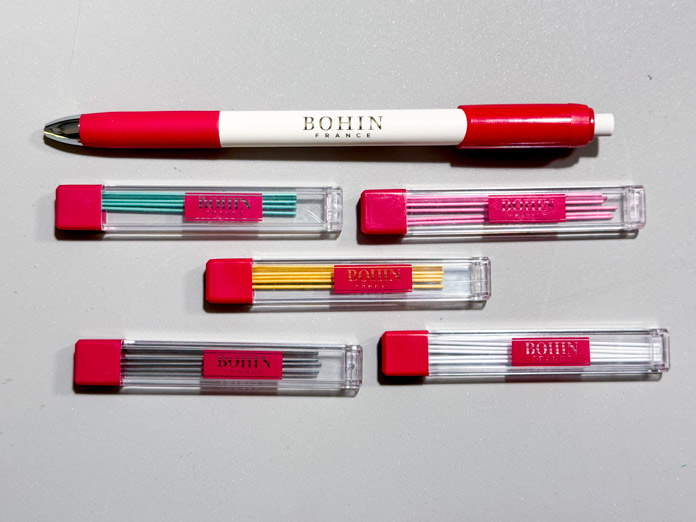 A BOHIN mechanical chalk pencil with 5 containers, each with a different colored lead.