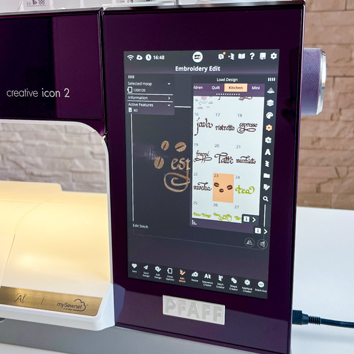 The screen of the PFAFF creative icon 2 embroidery and sewing machine displays the built-in embroidery library with the Kitchen collection opened. Design #23 from the collection is selected. The selected hoop is PFAFF creative 120 Square Hoop (120 x 120 mm) with 6D Dynamic Spring Foot enabled