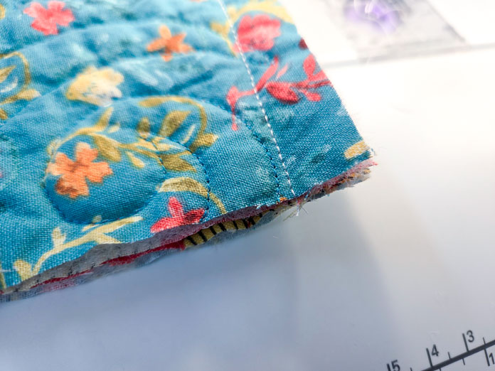 Blue fabric with white stitching