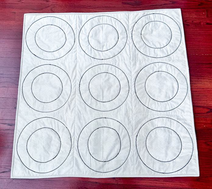 The back of the quilt with all the stitching showing.