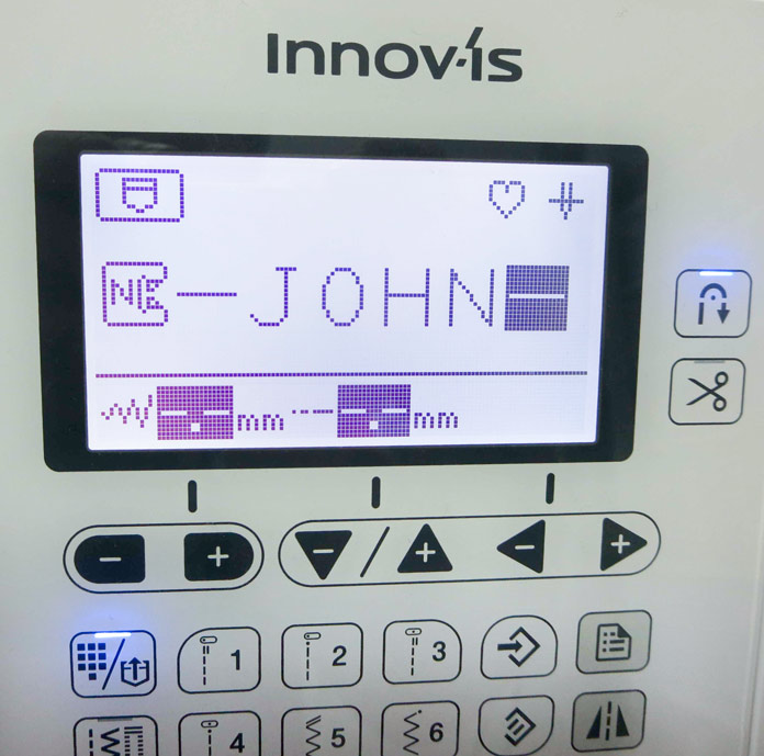 The name John is shown on the LED screen on a Brother NQ700 machine; Brother BQ3050, HeatnBond Feather Lite, Brother SA185 ¼" Piecing Foot-Guide, Brother SA125 ¼" Quilting Foot, Brother SA186 Metal Open-Toe Foot, SULKY Heidi Lund's Life in the Tropics Cotton Blendables Thread Collection