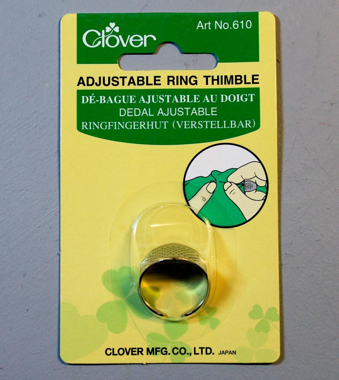 The Clover Adjustable Ring Thimble in its package