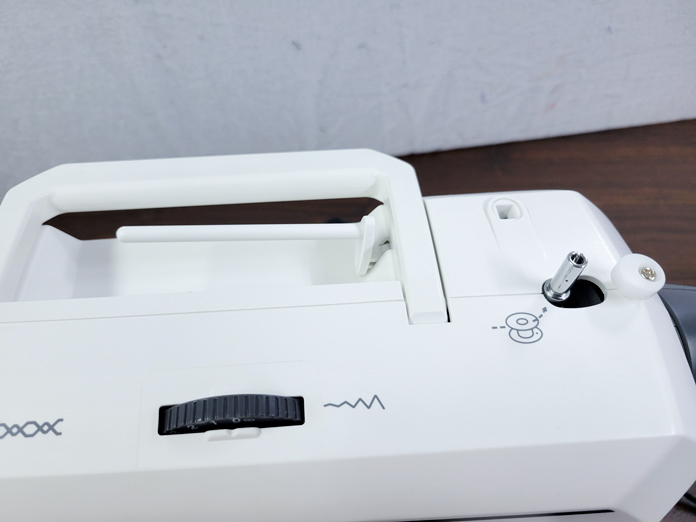 The top of a white sewing machine