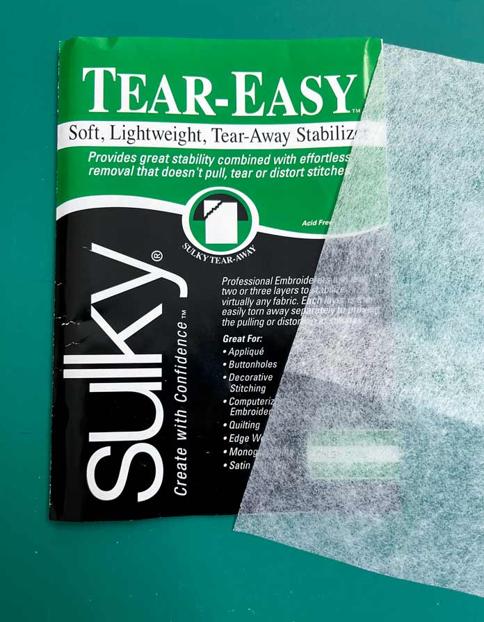 1 package of Sulky Tear-Easy Stabilizer; OMNIGRIP Ruler 8½" x 8½", OLFA 45 mm Ergonomic Rotary Cutter, OLFA Endurance Rotary Blades, Sulky Tear-Easy Stabilizer, Odif 505 Adhesive Fabric Spray, OLISO PRO TG1600 Pro Plus Smart Iron, Mary Ellen’s Best Press, Best Press Spray and Misting Bottle