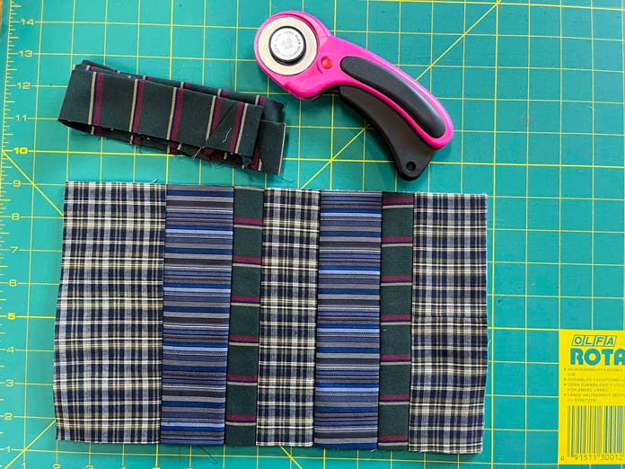 Excess fabric has been cut from outside edges. Binding is ready to be sewn on; OMNIGRIP Ruler 8½" x 8½", OLFA 45 mm Ergonomic Rotary Cutter, OLFA Endurance Rotary Blades, Sulky Tear-Easy stabilizer, Odif 505 Adhesive Fabric Spray, OLISO PRO TG1600 Pro Plus Smart Iron, Mary Ellen’s Best Press, Best Press Spray and Misting Bottle