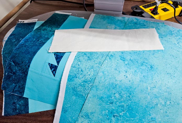 Teal fabric and a white fabric