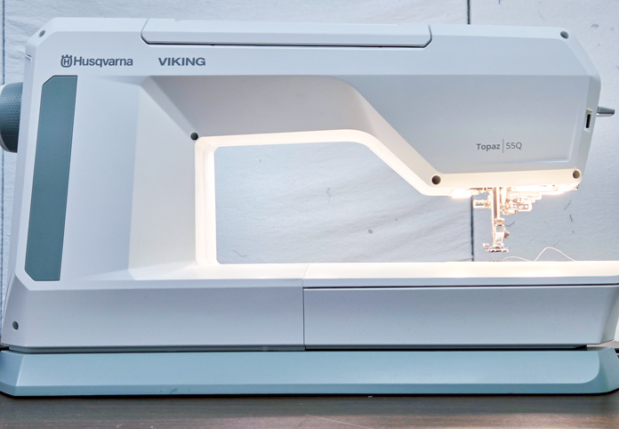 The back of a white sewing machine