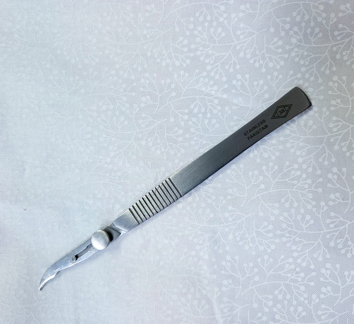A surgical seam ripper