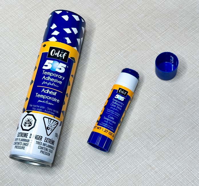 A can of Odif 505 Temporary Quilt Basting Adhesive Fabric Spray and an Odif 505 Temporary Adhesive Glue Stick