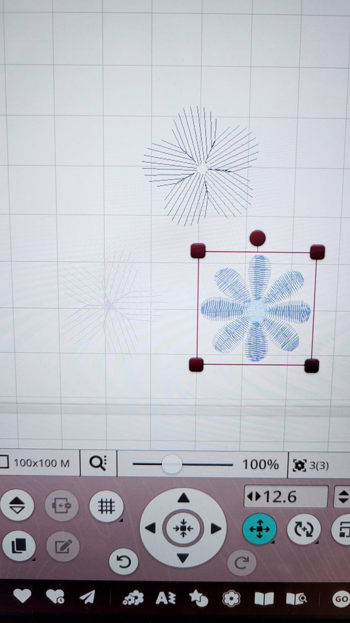Three machine embroidery flowers on an edit screen of a computerized embroidery machine; Husqvarna Viking Designer Ruby 90