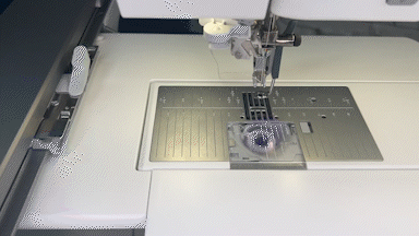 The PFAFF creative icon 2 Sewing and Embroidery Machine with attached embroidery unit showing the change to a straight stitch plate with attached dynamic spring foot and reloading the bobbin