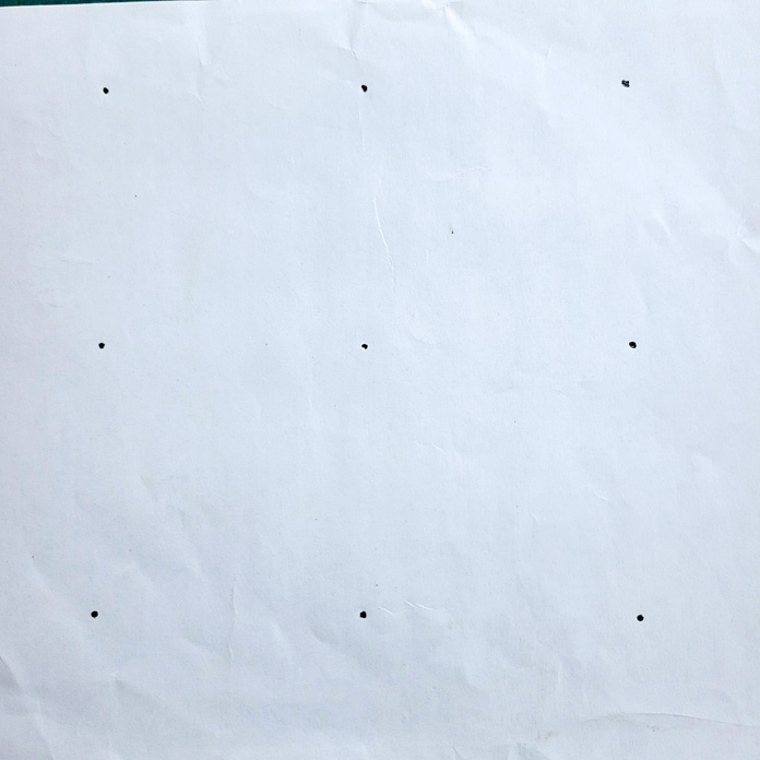 Nine dots on white paper