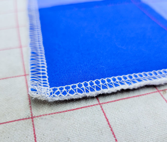 Blue fabric with white serging