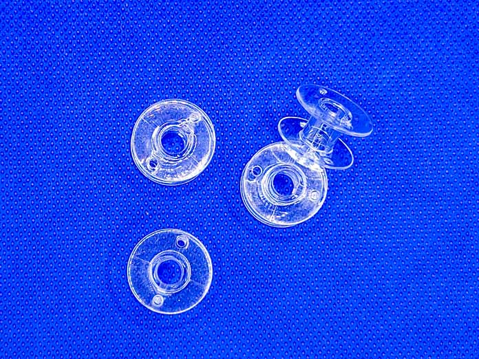 Four clear plastic bobbins for the Husqvarna VIKING ONYX 25