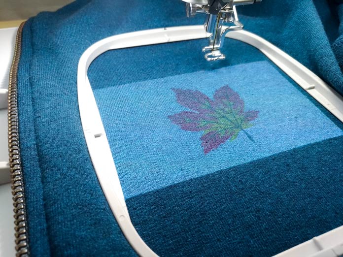 Maple leaf embroidery design projected onto your fabric with the Brother Luminaire XP. 