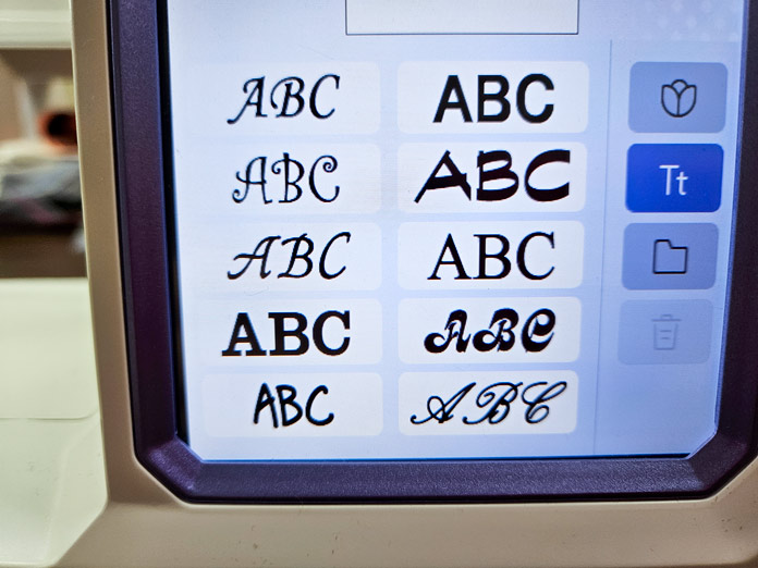 A screen with 10 font options on a computerized embroidery machine; Husqvarna VIKING Designer Quartz 29, mySewnet Machine Embroidery Software, Husqvarna VIKING Tear-a-Way Light Stabilizer 15 Inches x 25 Yards