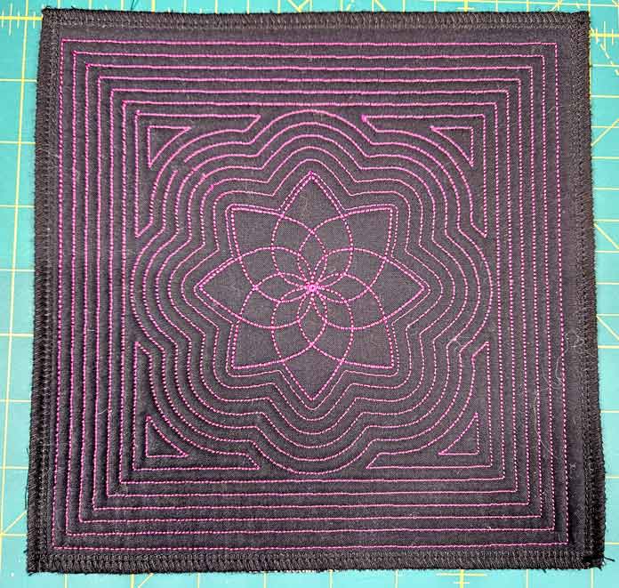 Pink stitching on black fabric; machine embroidery, quilting, mySewnet, HUSQVARNA VIKING, embroidery software, digital embroidery, quilt block wizard, applique, embroidery design, monogramming