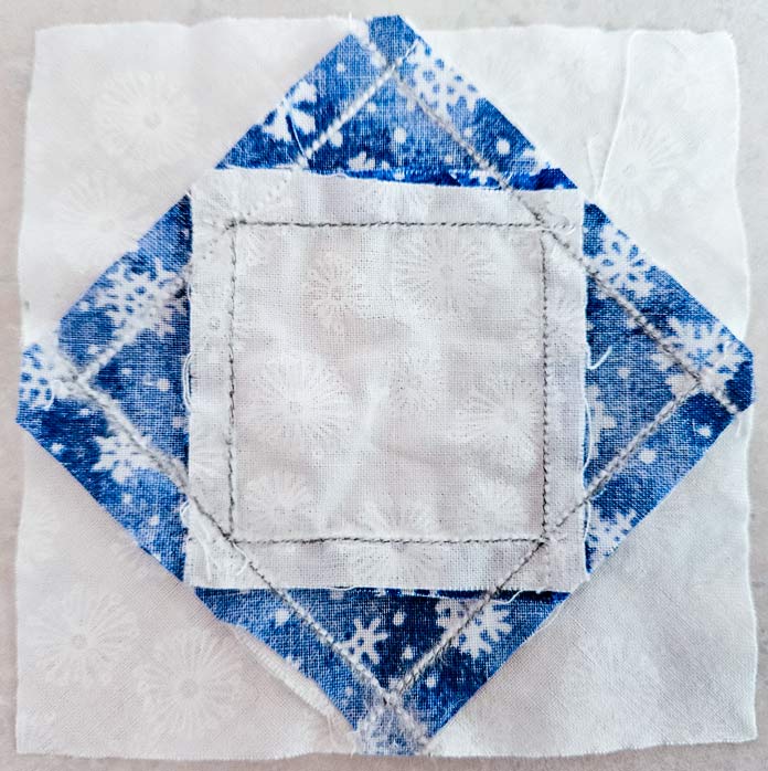The back of a paper pieced quilt block