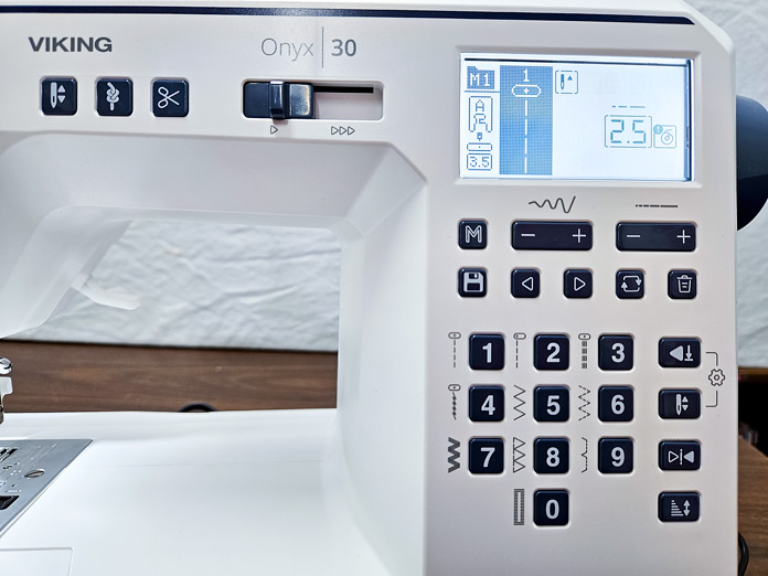 A screen on a sewing machine