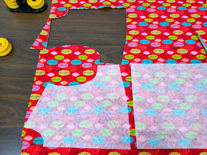 Pattern pieces on red fabric