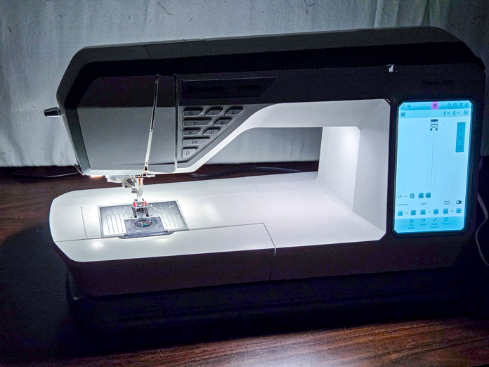 Brilliant lights on a sewing machine in a dark room