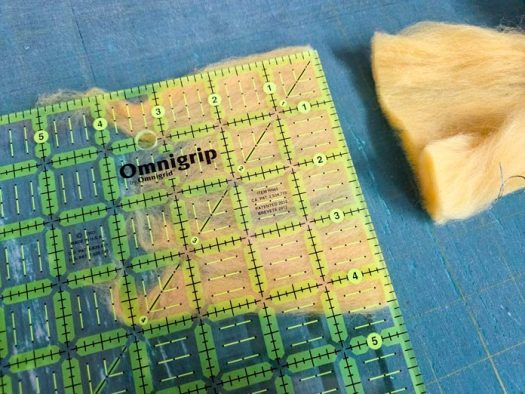 Yellow roving and quilting ruler