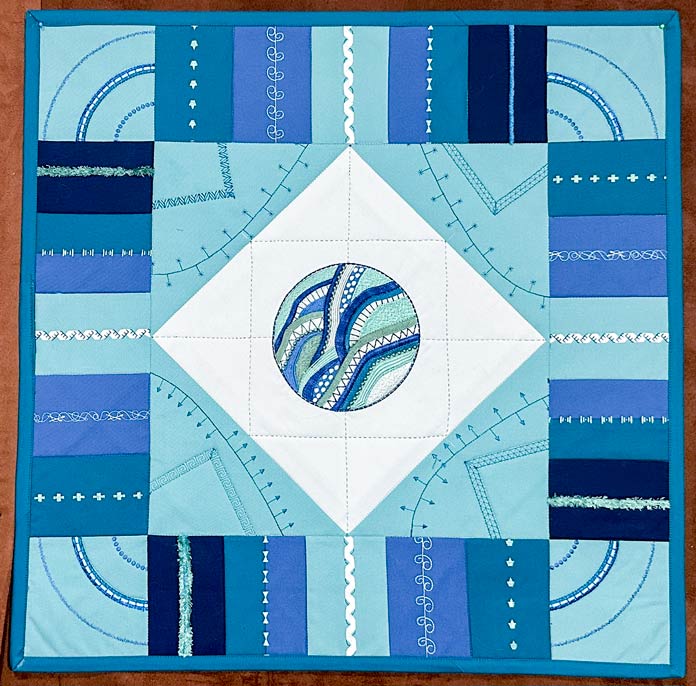 A blue, green, white embroidered centerpiece