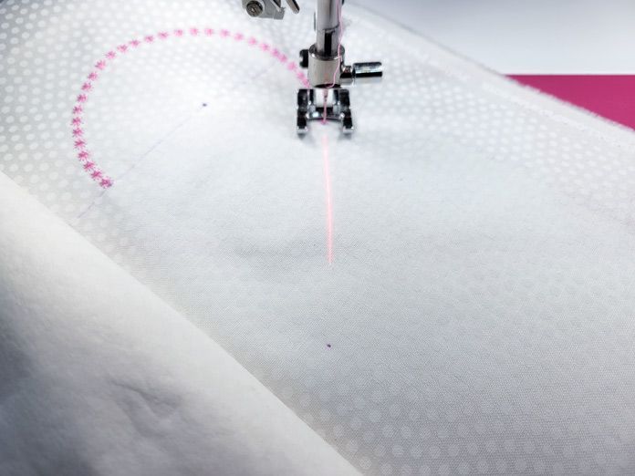 A red laser on white fabric; Husqvarna Viking Designer EPIC 2