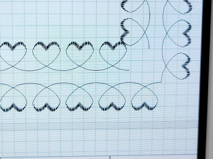 The corner of two rows of heart stitches on a computerized embroidery machine; Husqvarna Viking DESIGNER EPIC 2