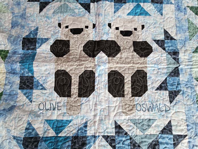 Two otters on a quilt; quilting, embroidery machine, machine embroidery, quilting techniques, Husqvarna VIKING, quilt labels, embroidery software, quilt embellishments, quilting tools, QUILTsocial