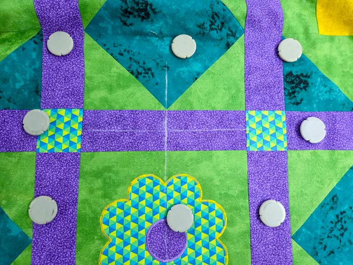 White chalk lines on a quilt top; Creativate Embroidery Software