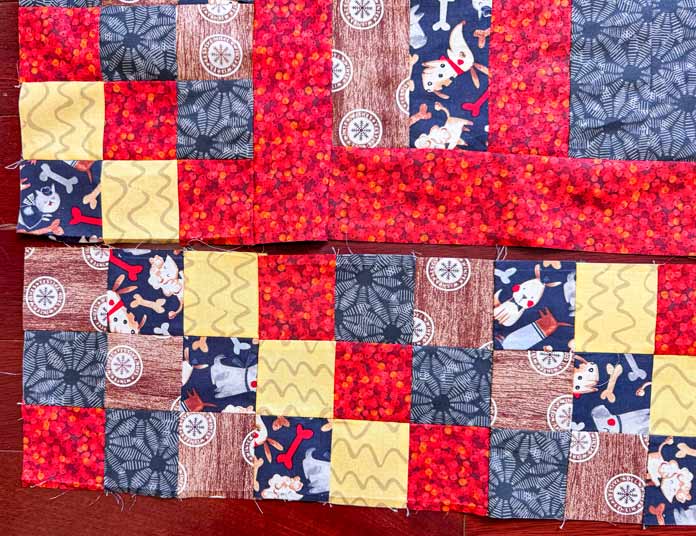 a border is audition next to the quilt’s center before sewing.