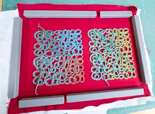 Yarn designs in blue and green fabric on red fabric