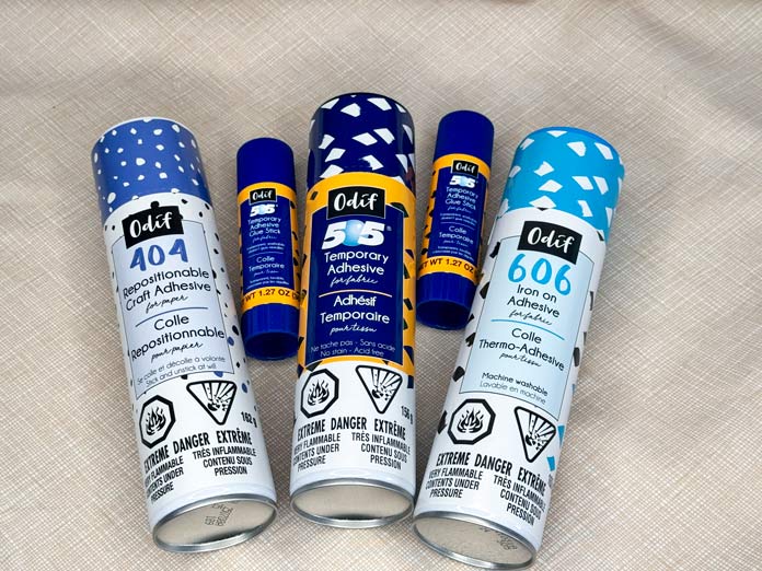 Can of Odif 404, 505 and 606 as well as two Odif 505 glue sticks