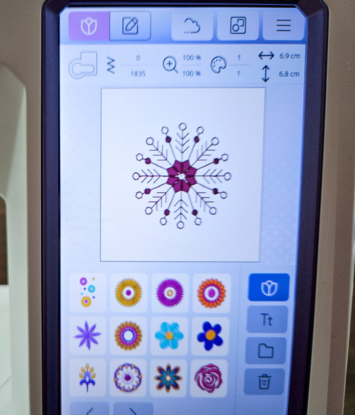 A snowflake design on a screen on a computerized sewing and embroidery machine; Husqvarna VIKING Designer Quartz 29, mySewnet Machine Embroidery Software, mySewnet Library, Husqvarna VIKING Tear-a-Way Light Stabilizer 15 Inches x 25 Yards