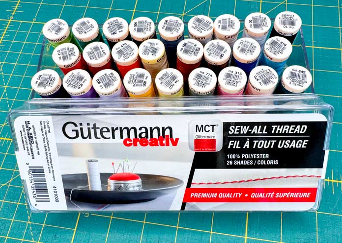 An acrylic box containing 26 vibrant colours of Gütermann Sew-All 100m Threads.