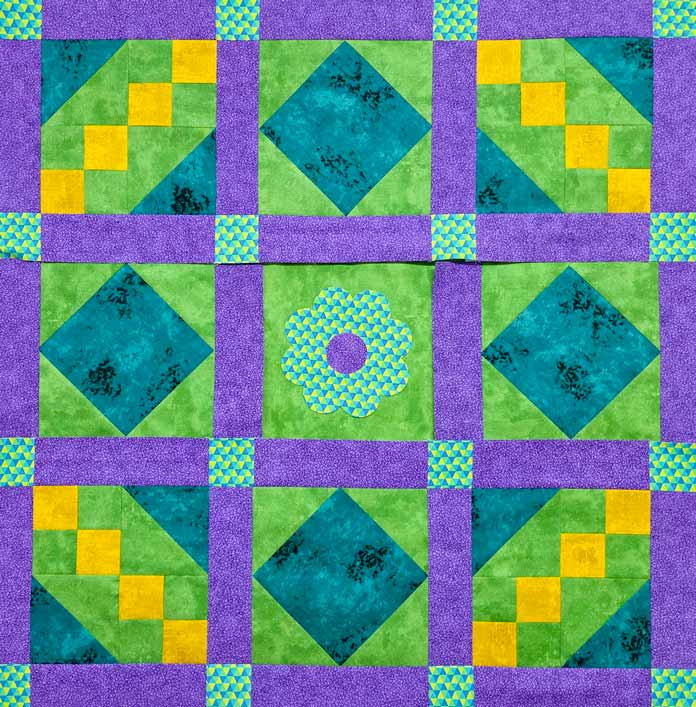 A purple, green, and yellow quilt