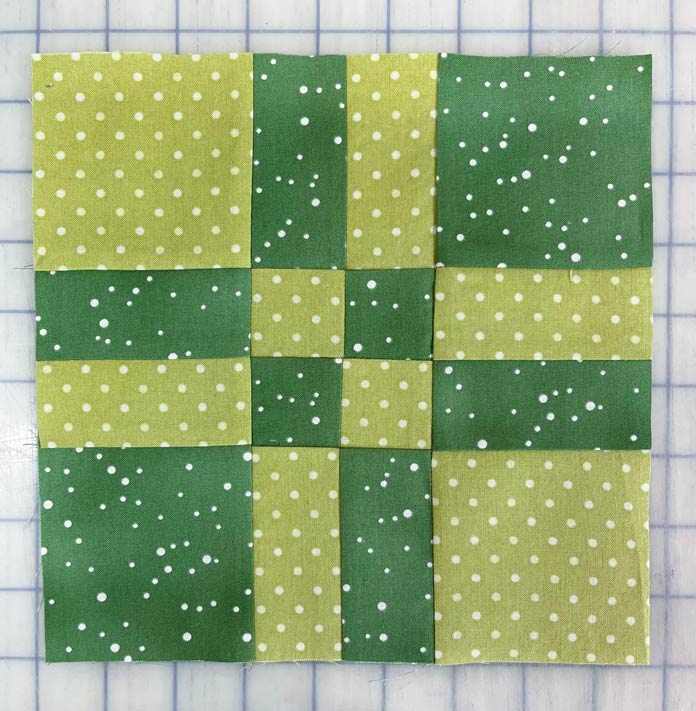 Finished block made from re-arranging squares that were cut from a Four-Patch block.