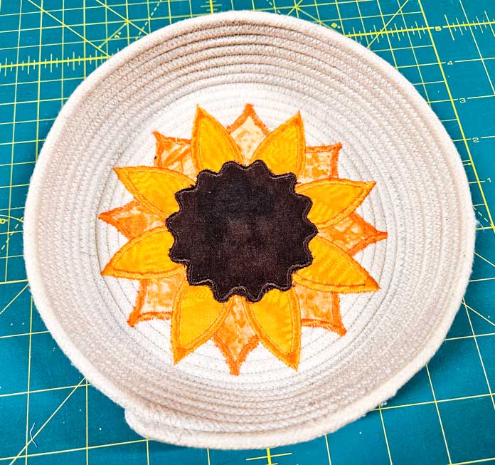 A fabric sunflower stitched on rope; machine embroidery, quilting, mySewnet, HUSQVARNA VIKING, embroidery software, digital embroidery, quilt block wizard, applique, embroidery design, monogramming